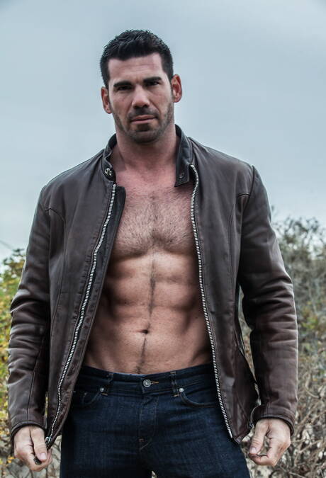 Two american guys muscular Billy Santoro and bodybuilder Seth Santoro shows a muscle body on beach