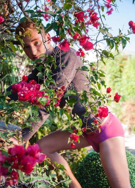 American twink Casey Tanner posing naked and showing tight ass outside