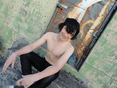 American twink Josh Bensan teasing his dick outside