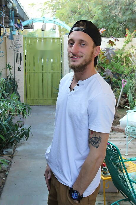 Well-built Corey Gunz teasing his dick outside