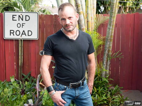 Bear Bruce Bacch posing nude and showing his butt outside